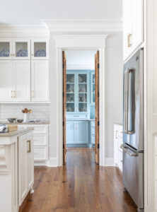 antique doors in white kitchen