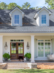 southern transitional home with antique brick porch