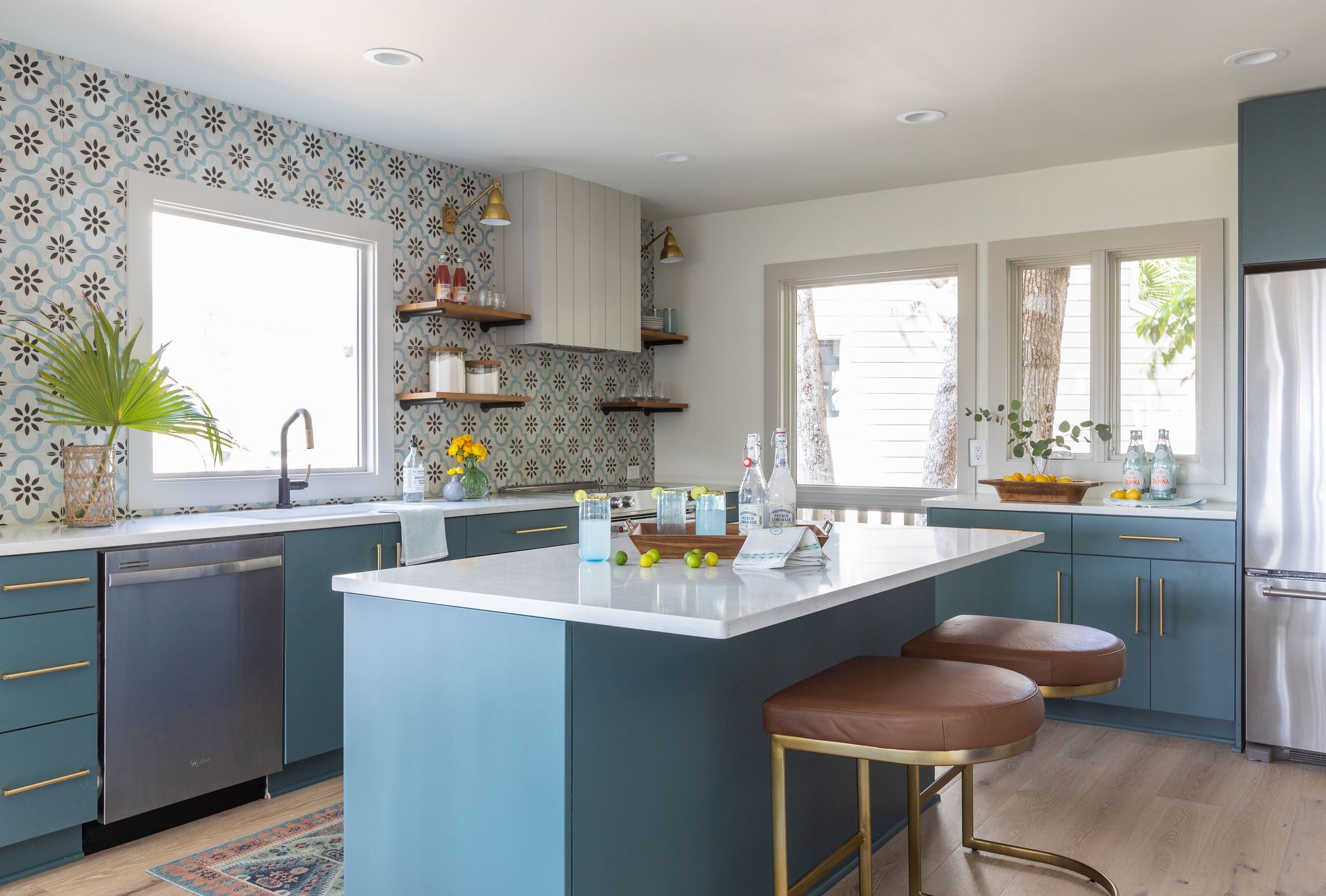 blue green kitchen with open shelving and patterned backsplash