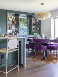 eclectic dining room with purple chairs in beach condo