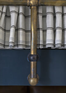 custom brass bunk bed with plaid privacy curtains