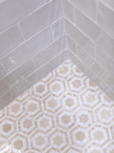 hexagon mosaic tile on floor in shower